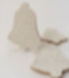 White hand decorated Christmas bell cookies