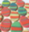 Pastel decorated egg-shaped sugar cookies.